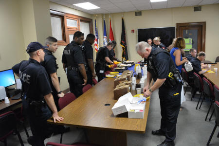 Police officers around table