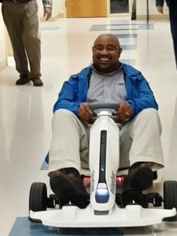 photo of Chad Younger driving an electric vehicle