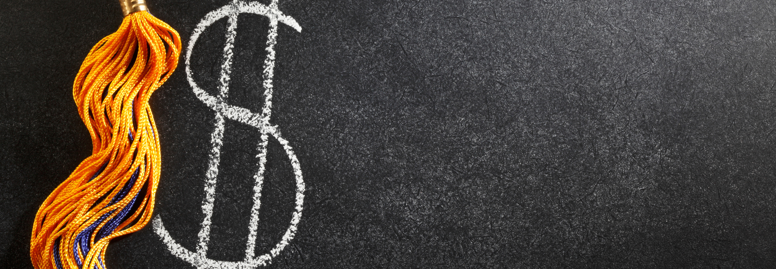 $ and graduation tassel on black background.