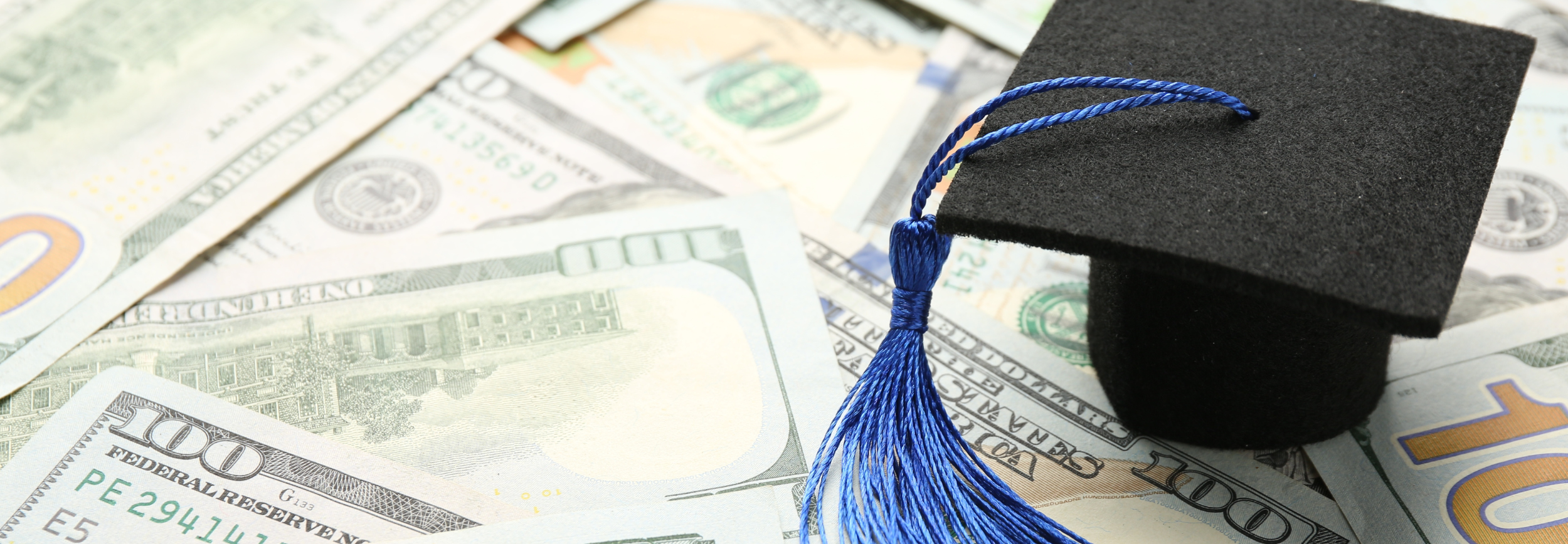 Decorative Image: Money and graduation cap. 