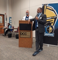 photo of Dr. Cornelius Johnson and Dr. James Emerson speaking at a podium in Oliver Hall at Danville Community College